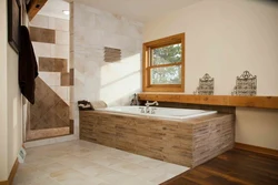 Bathtub with wooden floor photo