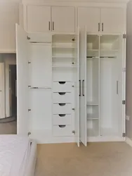 Linen closet with shelves in the bedroom photo