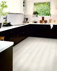White linoleum in the interior of the kitchen