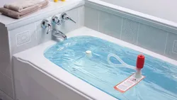 Photo Of A Bathtub With Water In An Apartment