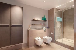 Bathtub with wall-hung toilet photo