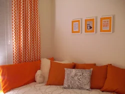 Orange curtains in the bedroom interior