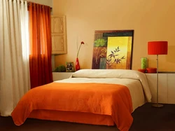 Orange curtains in the bedroom interior