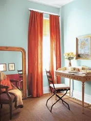 Orange curtains in the bedroom interior