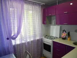Lilac curtains in the kitchen interior