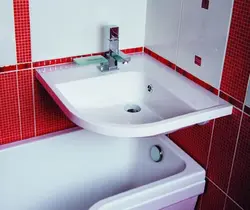 Bathtub sink above bathtub photo