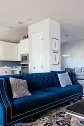 Blue sofa in the interior of the kitchen living room photo