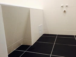 Baseboard for bathroom floor on tiles photo