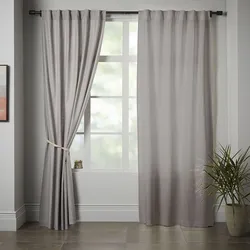 Canvas curtains in the living room interior
