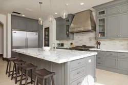 Beige kitchen with gray countertop in the interior