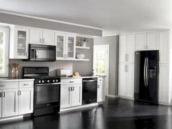 Photo of a kitchen with a white refrigerator