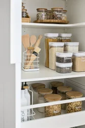 Organizing storage in the kitchen in cabinets photo