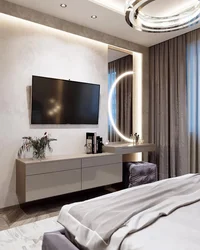 Bedroom design with tv by the window