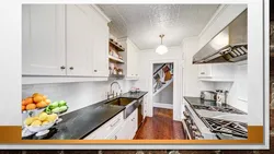 Kitchen covered in tiles up to the ceiling photo