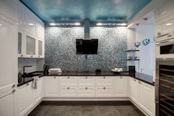 Kitchen covered in tiles up to the ceiling photo