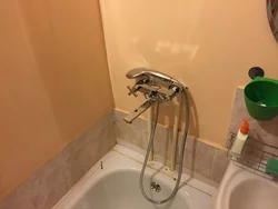 Faucet in the wall in the bathroom photo