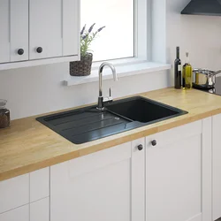 White kitchen black sink photo