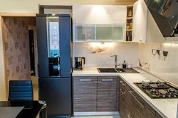 Black Refrigerator In The Kitchen Interior