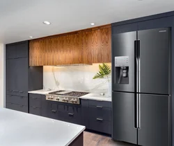 Black refrigerator in the kitchen interior