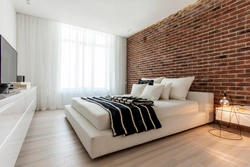 Brick wallpaper in the bedroom interior