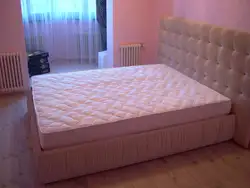 Double bed with mattress photo