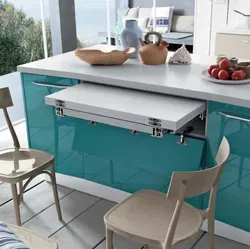 Small kitchen with pull-out table photo