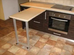 Small kitchen with pull-out table photo