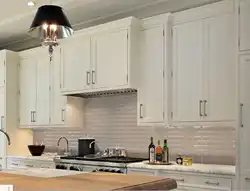 Aprons for white kitchen interior photo