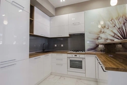Aprons for white kitchen interior photo