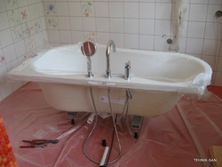 Photo Of The Bathtub Where The Faucets Are On The Bathtub