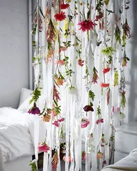 Tulle with flowers in the bedroom interior