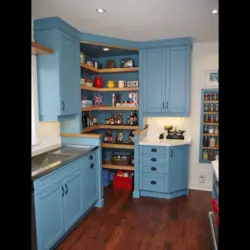 Photo of a corner kitchen with open shelves