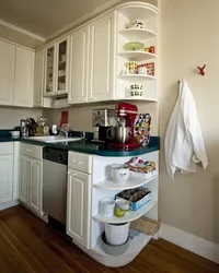 Photo of a corner kitchen with open shelves