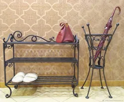 Forged shoe rack in the hallway photo