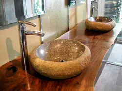 Bathroom sinks made of stone photo