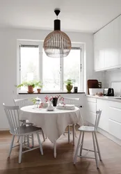 Photos of small kitchens with a round table