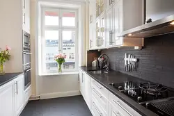 White kitchen in the interior with a dark apron