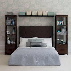 Photo of a bedroom with a bed and bedside tables