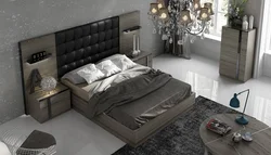 Photo of a bedroom with a bed and bedside tables