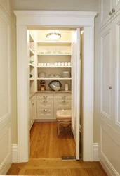 Refrigerator in a niche in the interior of the kitchen