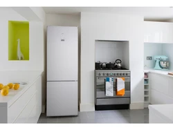 Refrigerator in a niche in the interior of the kitchen