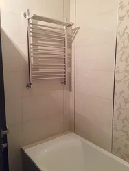 How to hang a heated towel rail in the bathroom photo