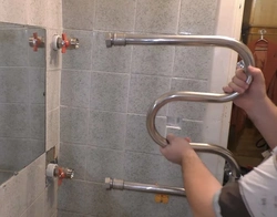 How to hang a heated towel rail in the bathroom photo
