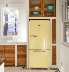 Narrow refrigerator in a small kitchen photo