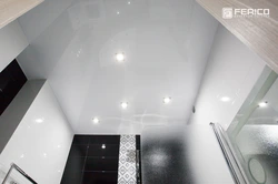 Photo of glossy stretch ceilings in the bathroom