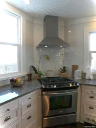 Photo of the kitchen with a stove in the corner