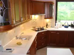 Photo Of The Kitchen With A Stove In The Corner