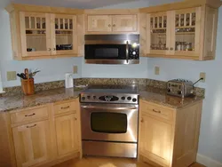 Photo Of The Kitchen With A Stove In The Corner