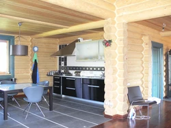 Kitchen in a wooden house made of logs inside photo