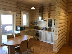 Kitchen in a wooden house made of logs inside photo